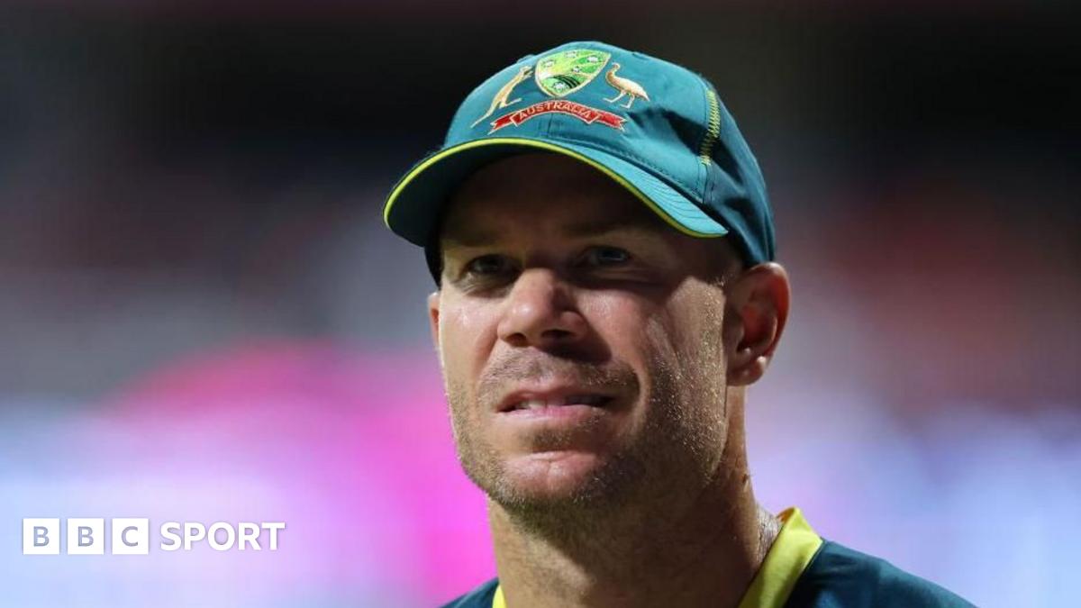 David Warner wearing an Australia cap